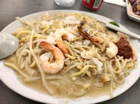 Hokkien Mee -  A symphony of succulent seafood and smoky wok hei that dances on your palate!